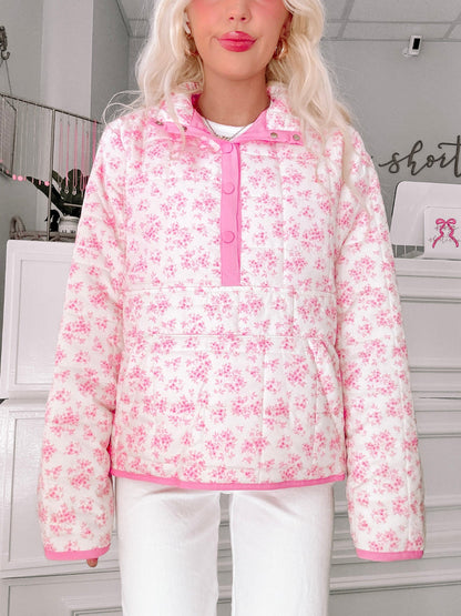 Floral Quilted Pullover from Sassy Shortcake - Person wearing a pink floral pullover in an indoor setting