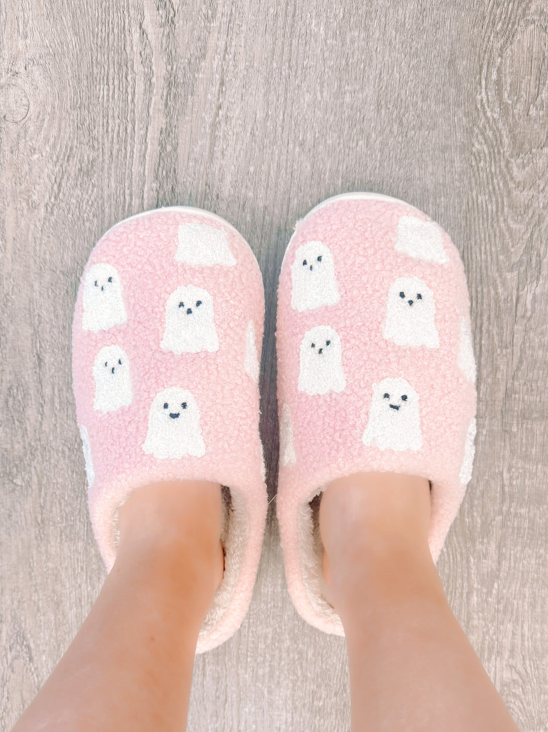 Pink Ghost slippers: cozy pink fuzzy slippers with cute ghost pattern.
