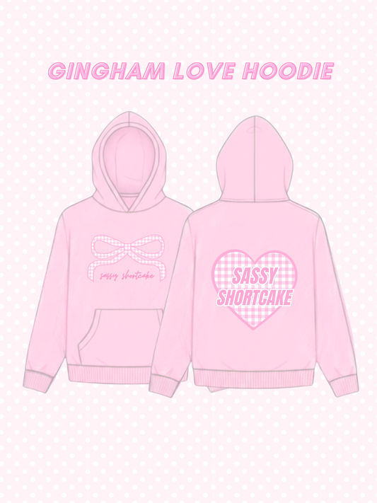 Gingham Love Hoodie from Sassy Shortcake - Pink gingham hoodie with text on a white background