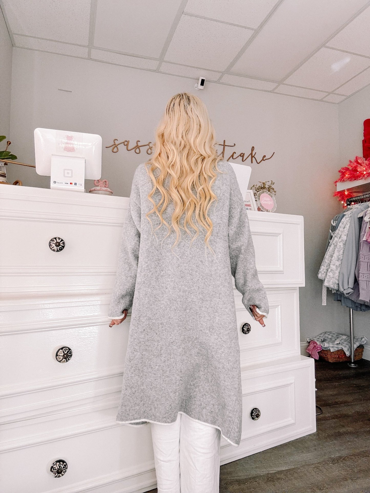Gray Haven Cardigan by Sassy Shortcake, back view of long belted knit coat with ivory contrast trim