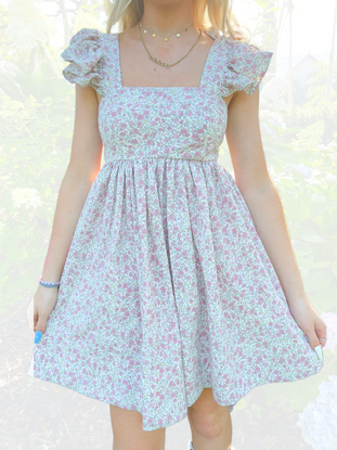Garden Girl Dress: Pretty pink and white floral print mini dress with ruffled sleeves.
