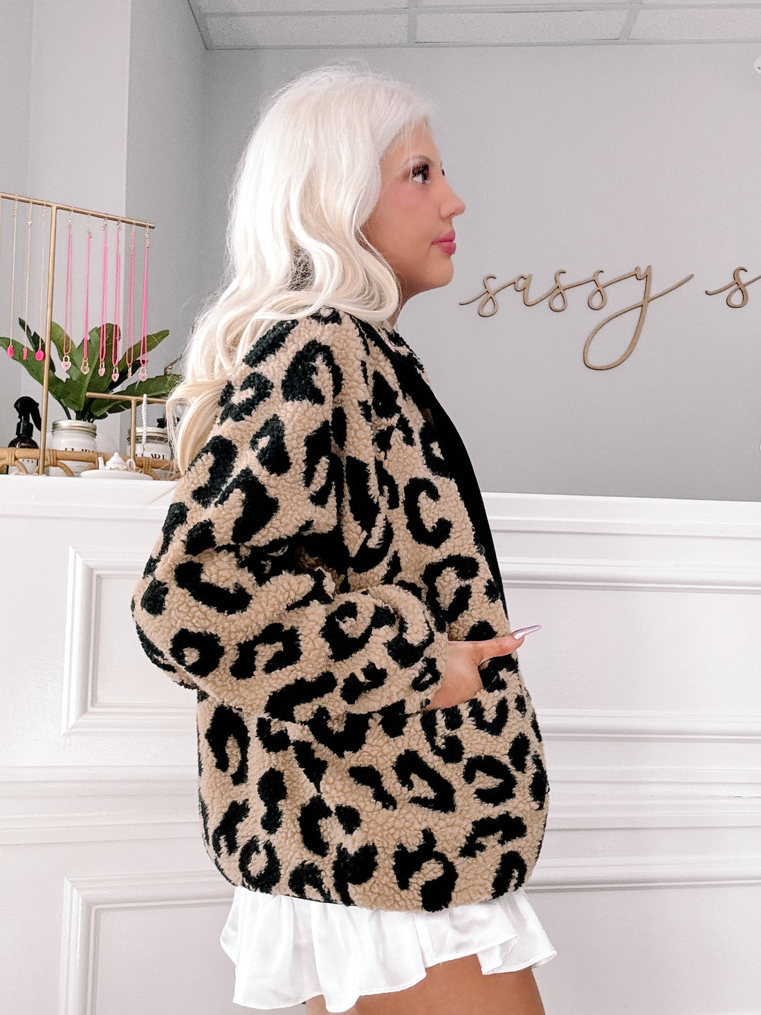 Tan and black leopard print sherpa jacket, side view.
