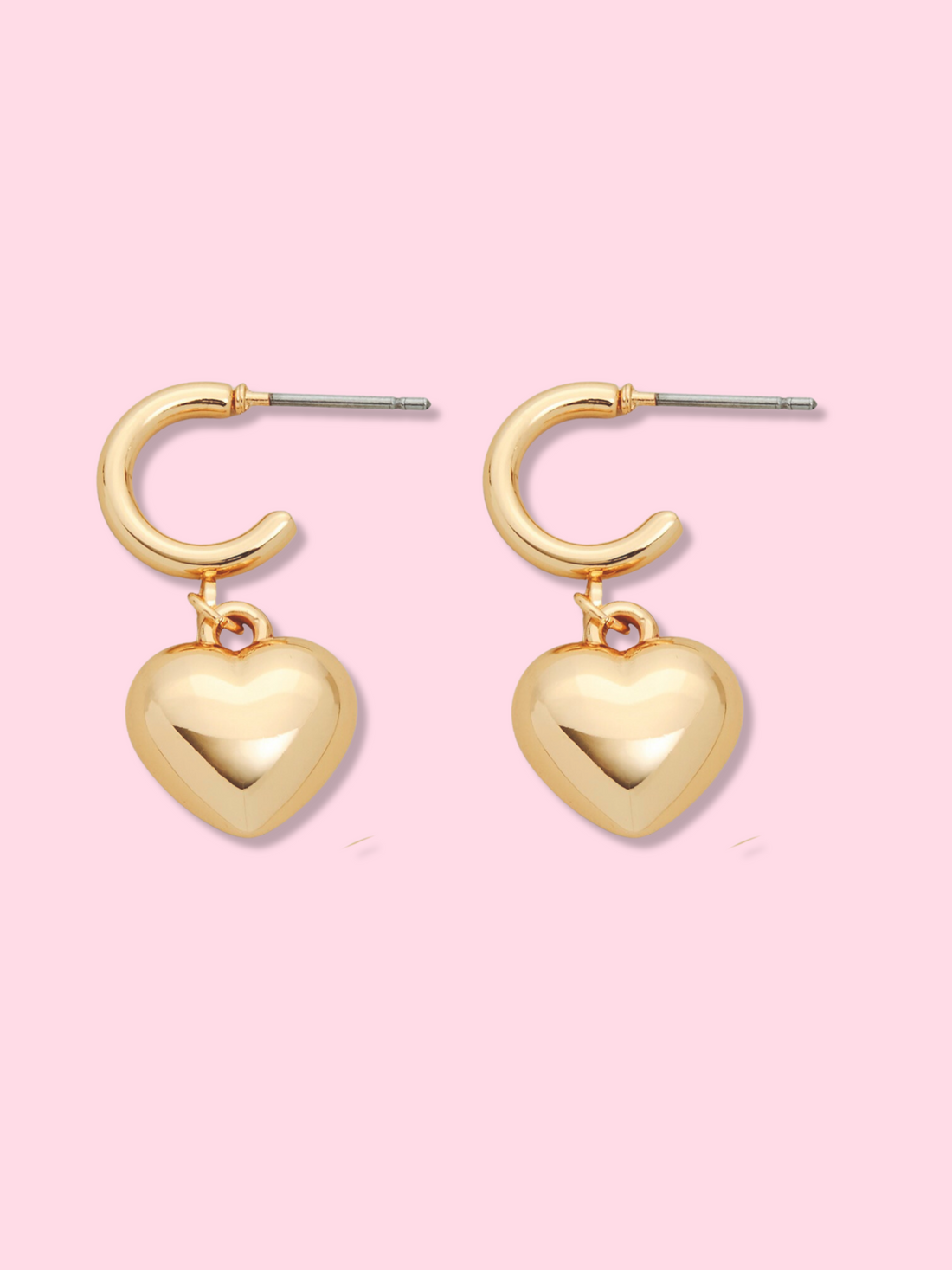 Gold Heartstruck Hoops earrings with dangling heart charms.
