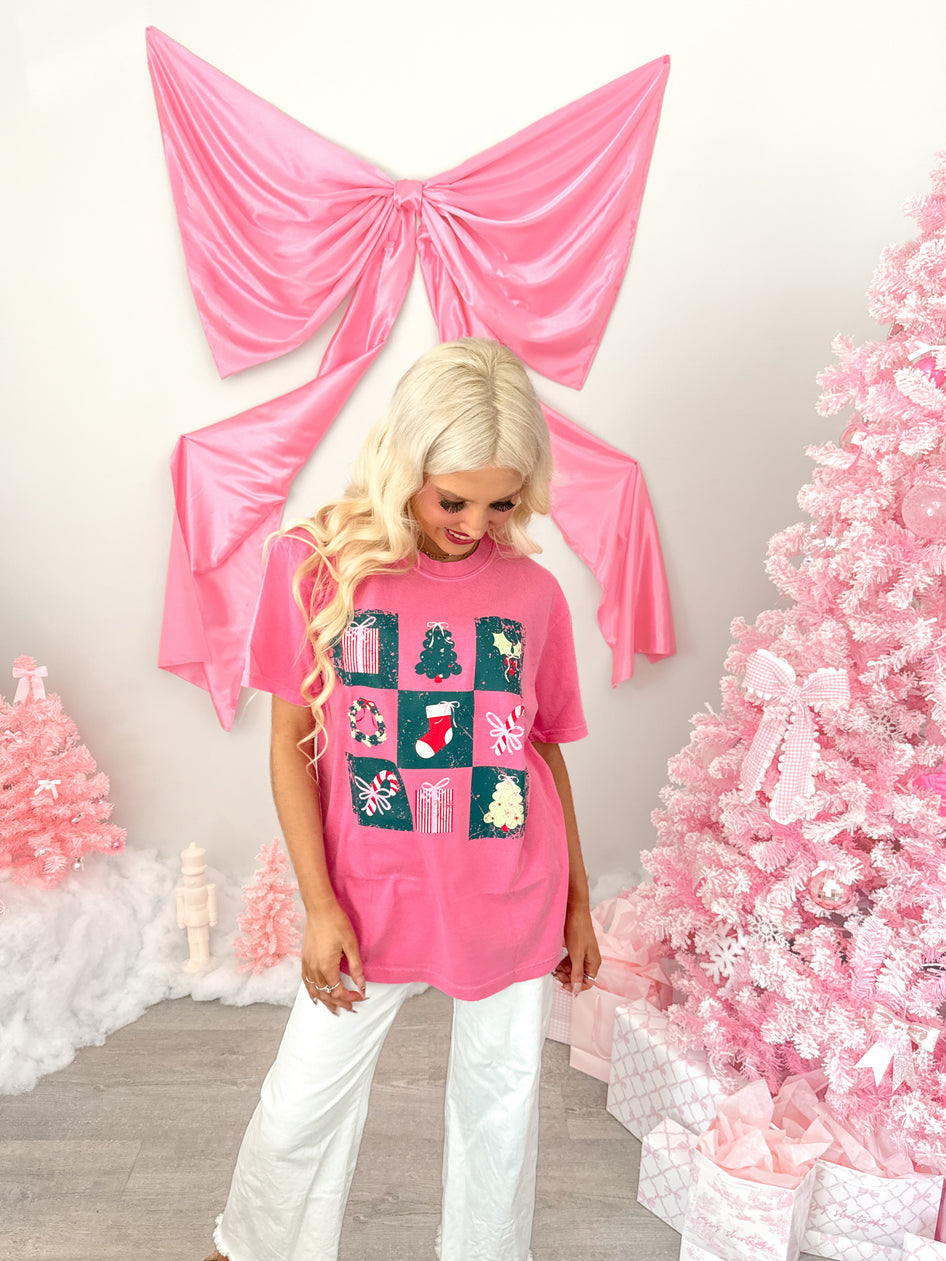 Holiday Board Pink Christmas Tee from Sassy Shortcake next to pink tree