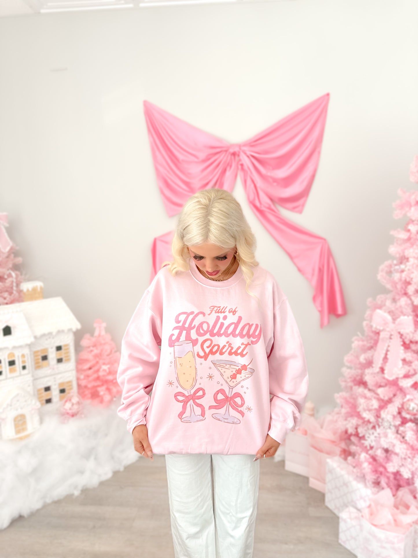 Model wearing Holiday Spirit Pink Crewneck from Sassy Shortcake 