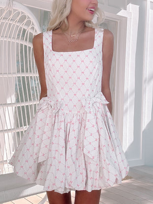 model wearing hot to bow dress
