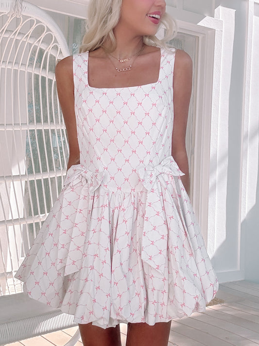 model wearing hot to bow dress 