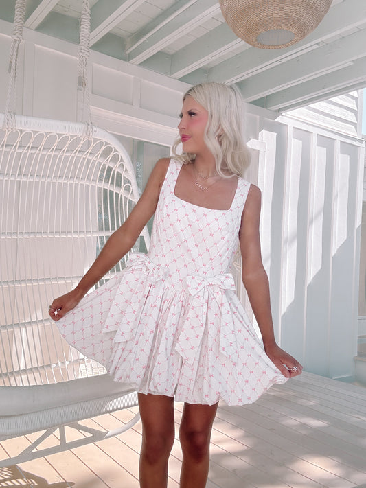 white dress with pink bow print
