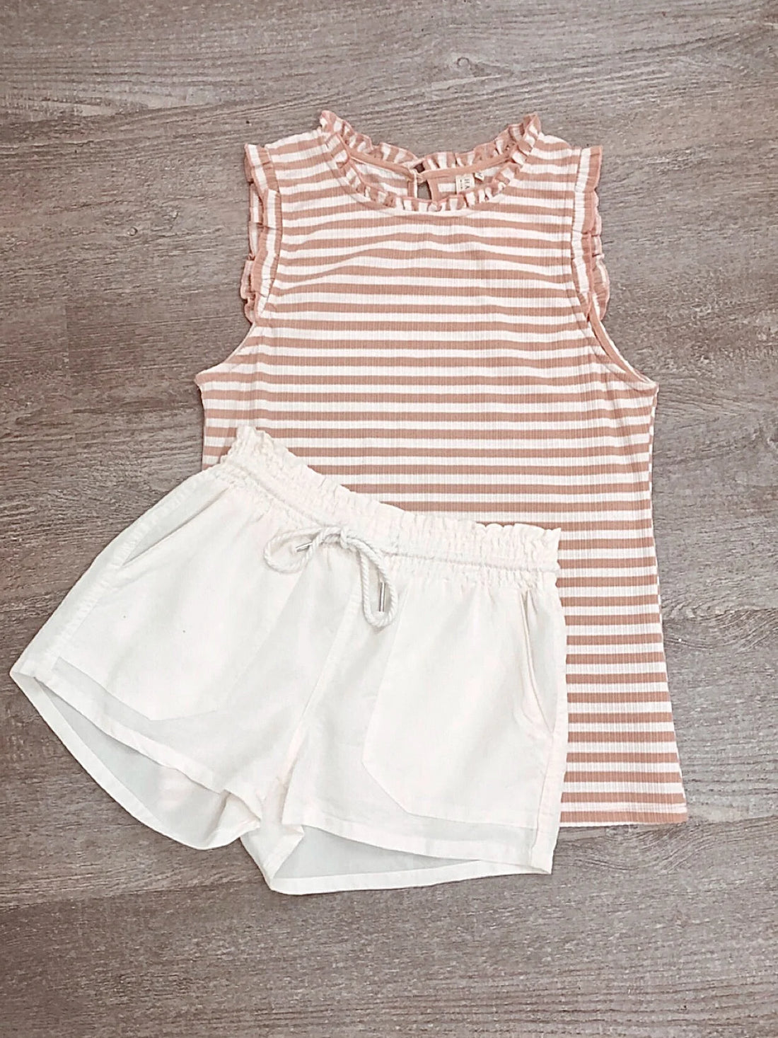 White In Plain View shorts with drawstring waist, perfect for summer.
