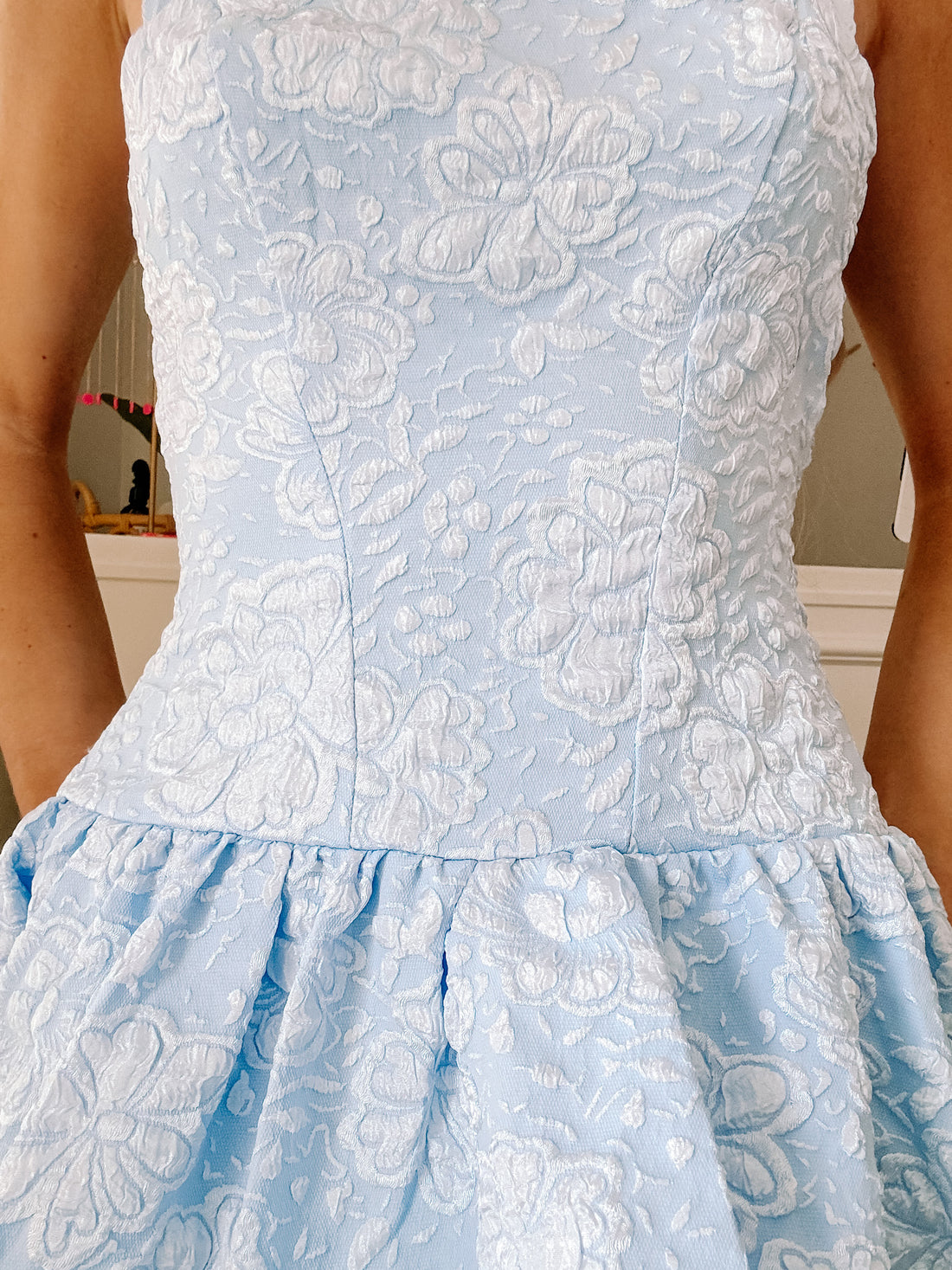 Close-up of shimmering floral jacquard fabric on In a Mist Dress for a soft, romantic look