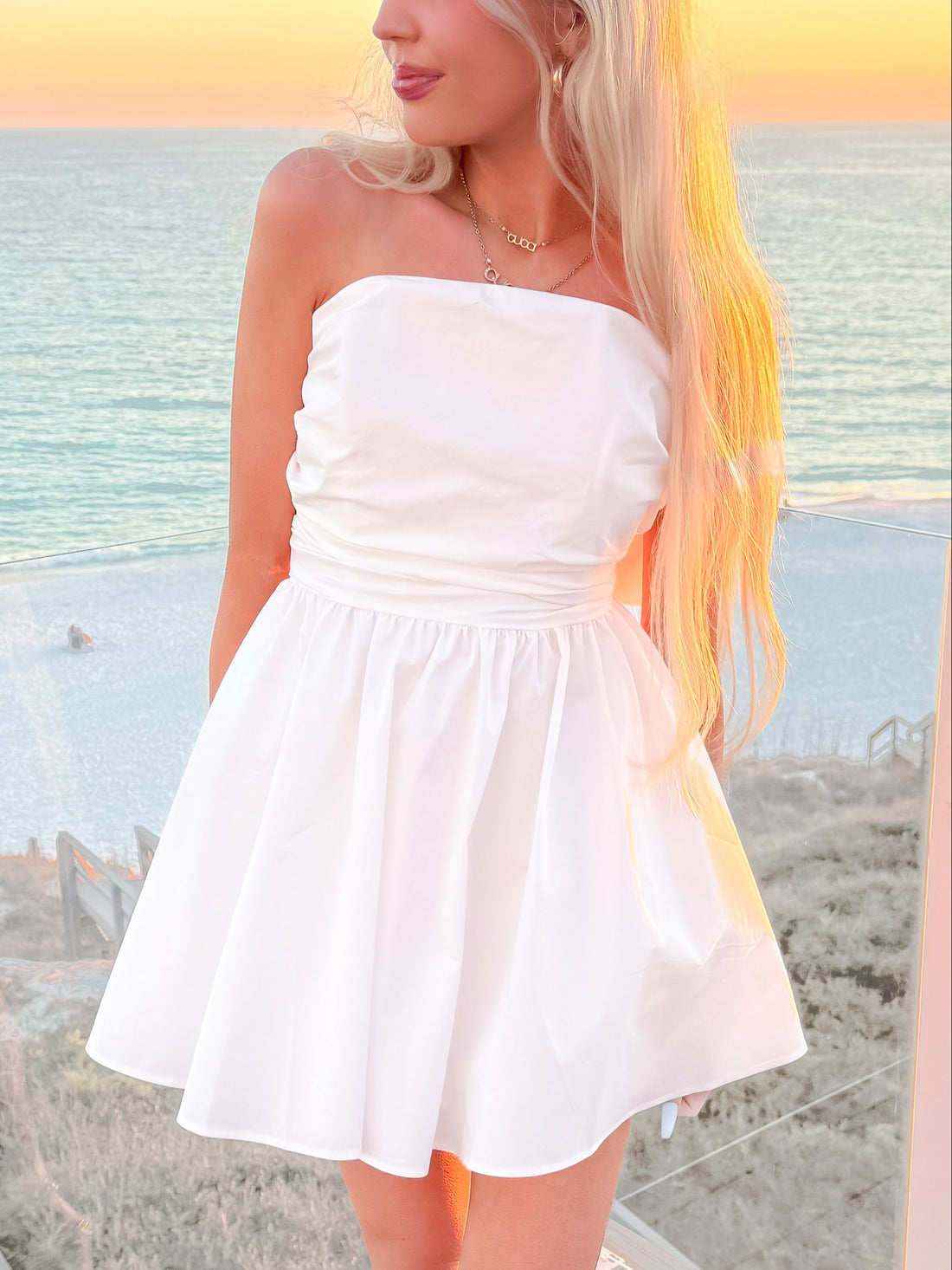 Strapless white mini dress