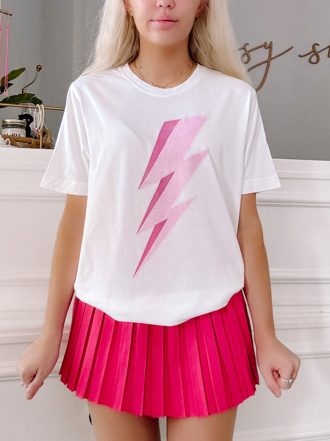 White Lightning Bolt Tee featuring a pink ombre graphic.
