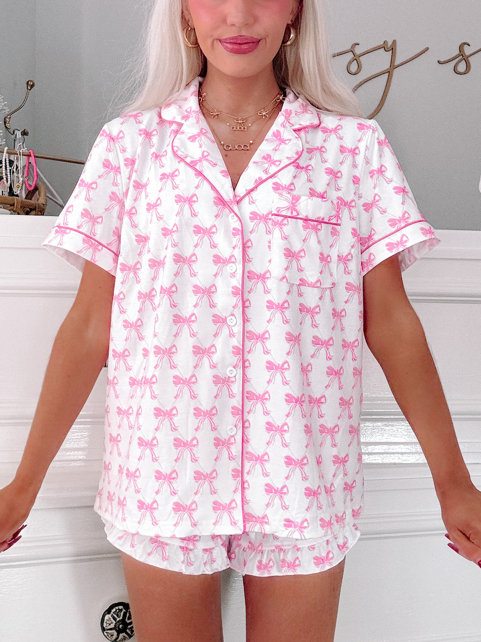 Little Bow Sleep Set: Pink bow print short sleeve pajama set, perfect for a comfortable night's sleep.
