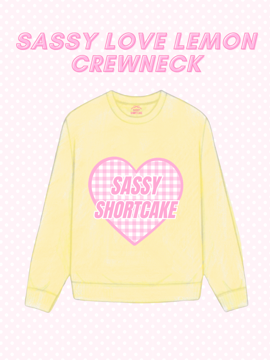 Sassy Love Lemon Crewneck from Sassy Shortcake - Yellow sweatshirt with pink heart graphic and text on a light pink background
