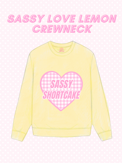 Sassy Love Lemon Crewneck from Sassy Shortcake - Yellow sweatshirt with pink heart graphic and text on a light pink background