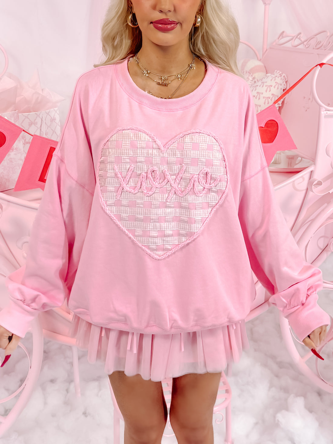 Pink Love Letters crewneck sweatshirt with gingham heart detail.
