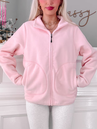 Pink fleece zip-up jacket, soft & cozy, casual style.
