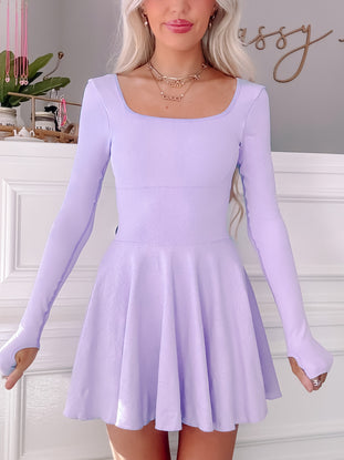 Lilac tennis dress with long sleeves and skater skirt.
