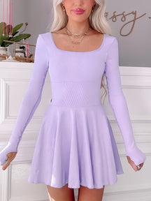 Lilac tennis dress with long sleeves and skater skirt.
