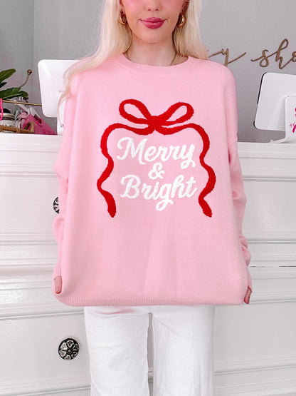 sassy shortcake girl wearing a pink sweater with 'Merry & Bright' text and red bow design.