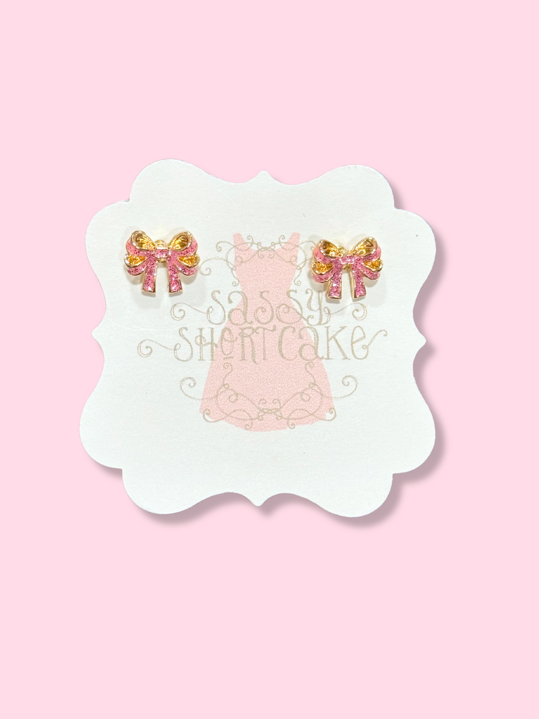 Sassy Shortcake Mini Crystal Bow Earrings: Pink & gold bow stud earrings.
