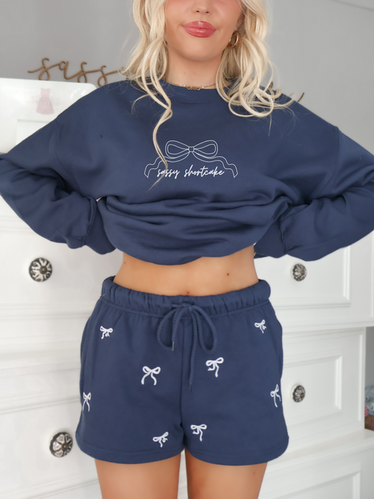 model wearing sassy shortcake navy bow embroidered shorts with matching crewneck