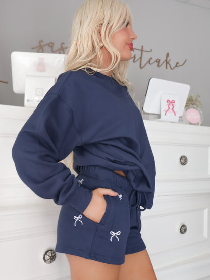 side view of sassy shortcake navy bow shorts with pockets