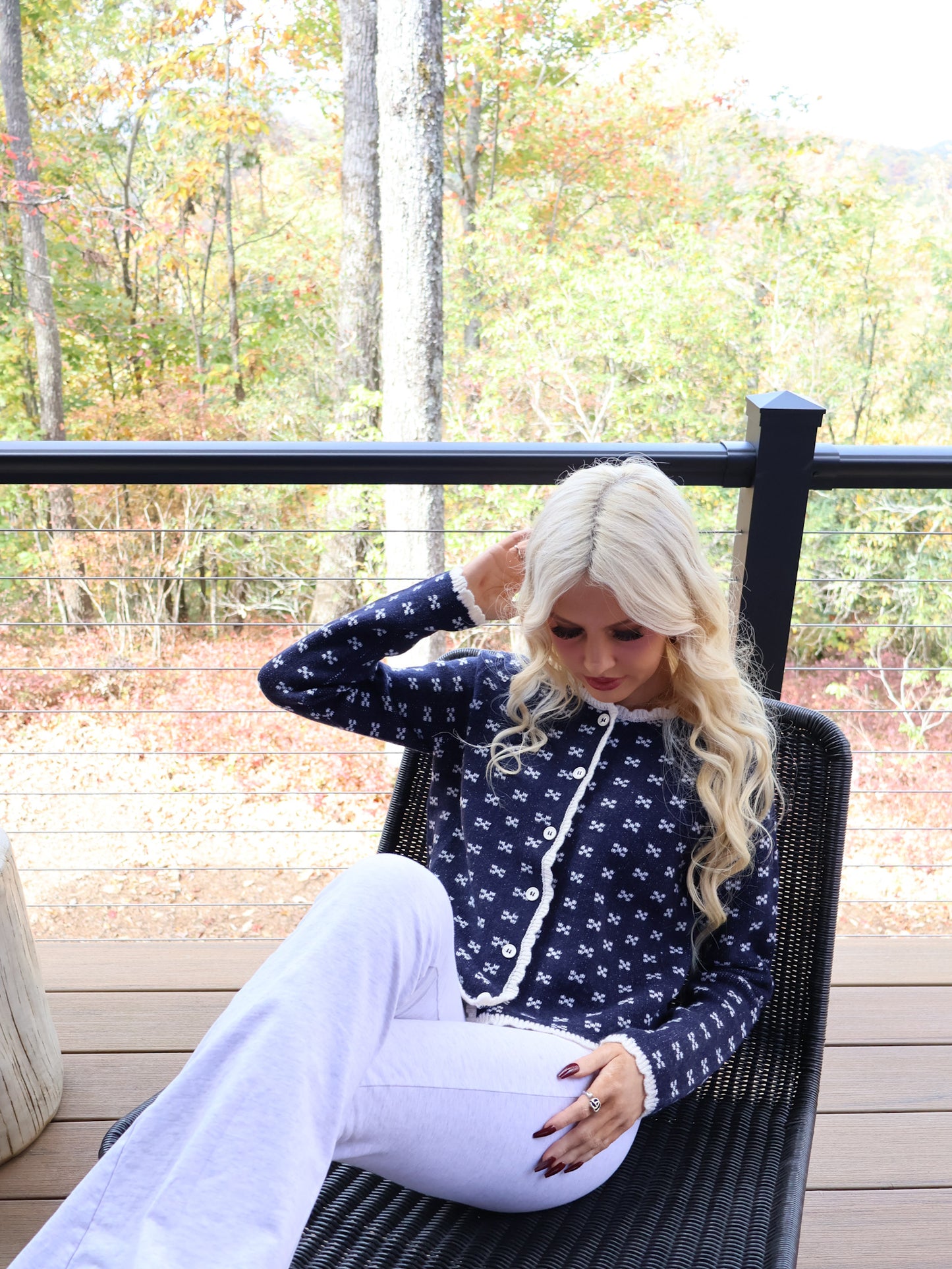 Cozy navy cardigan with a classic design, x-pattern texture, and charming scallop-edged trim from Sassy Shortcake.