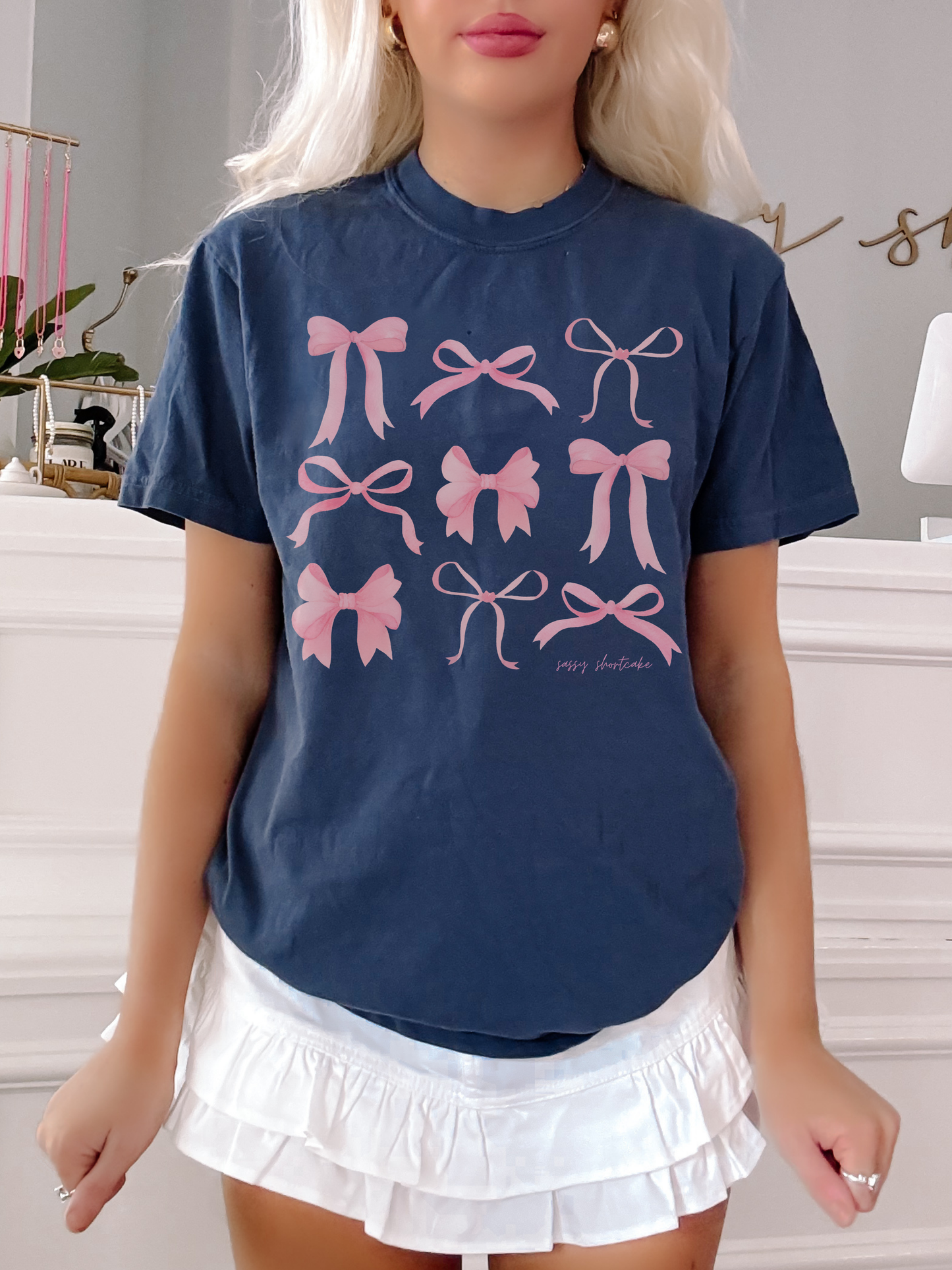 Sassy Shortcake On Bow Nine Tee, navy blue tee with pink bow print.
