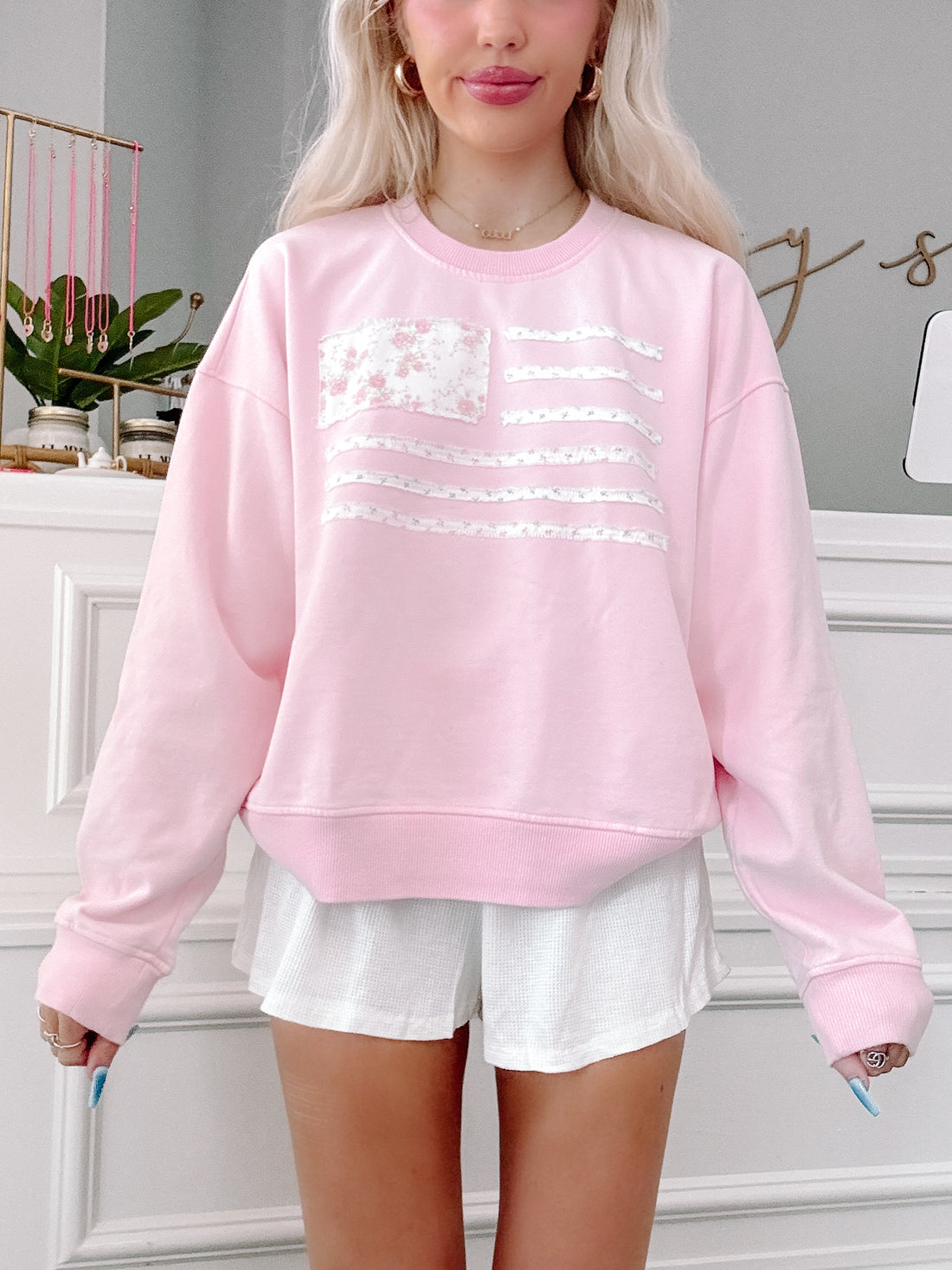 Front view of pink Patriotic Patchwork crewneck from Sassy Shortcake with American flag patchwork detail