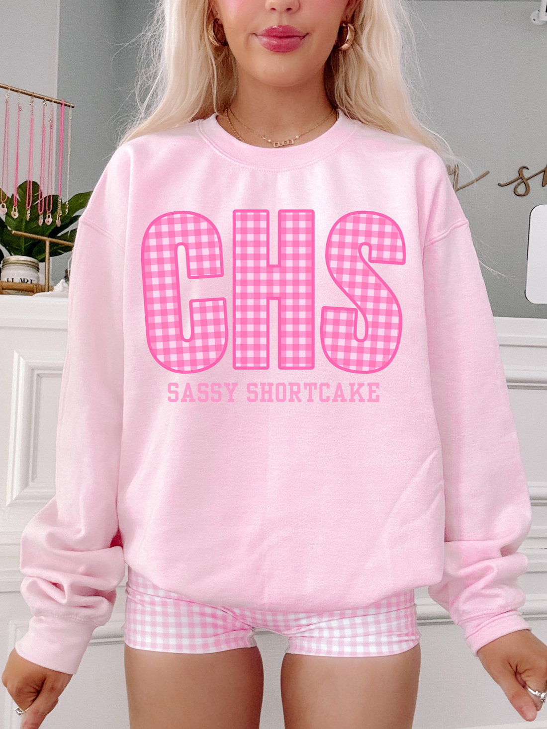 pink crewneck with pink gingham text