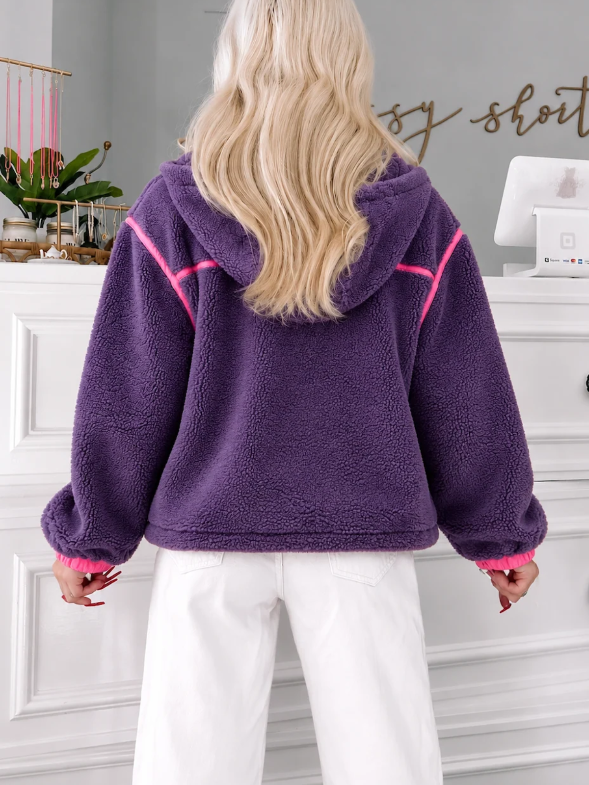 Back View of the Plum Pretty Pullover featuring plush purple sherpa fleece, hot pink trim, hood and cozy front pocket details from Sassy Shortcake