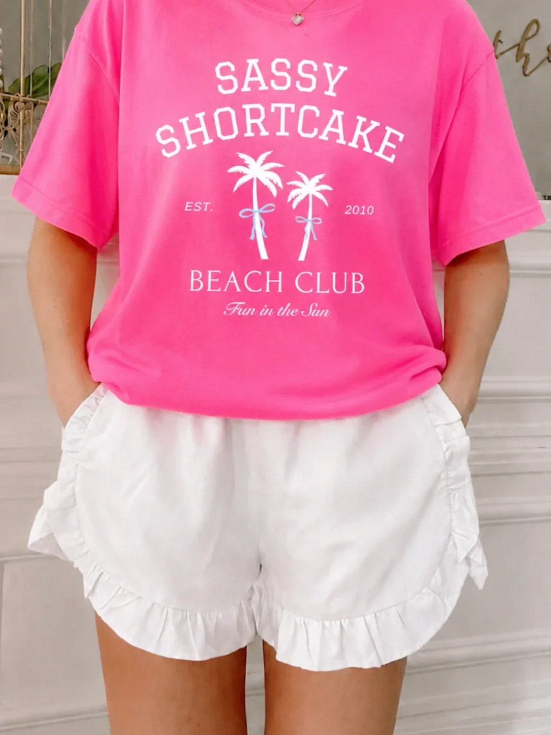 Pink and white preppy outfit featuring Enchanted Ruffle Shorts in White and Coquette Cutie Sweater from Sassy Shortcake