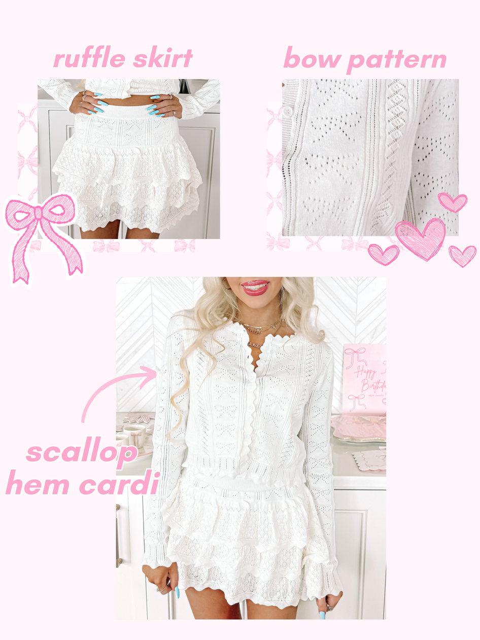 White pointelle knit cardigan and ruffle skirt set;  scalloped hem details.
