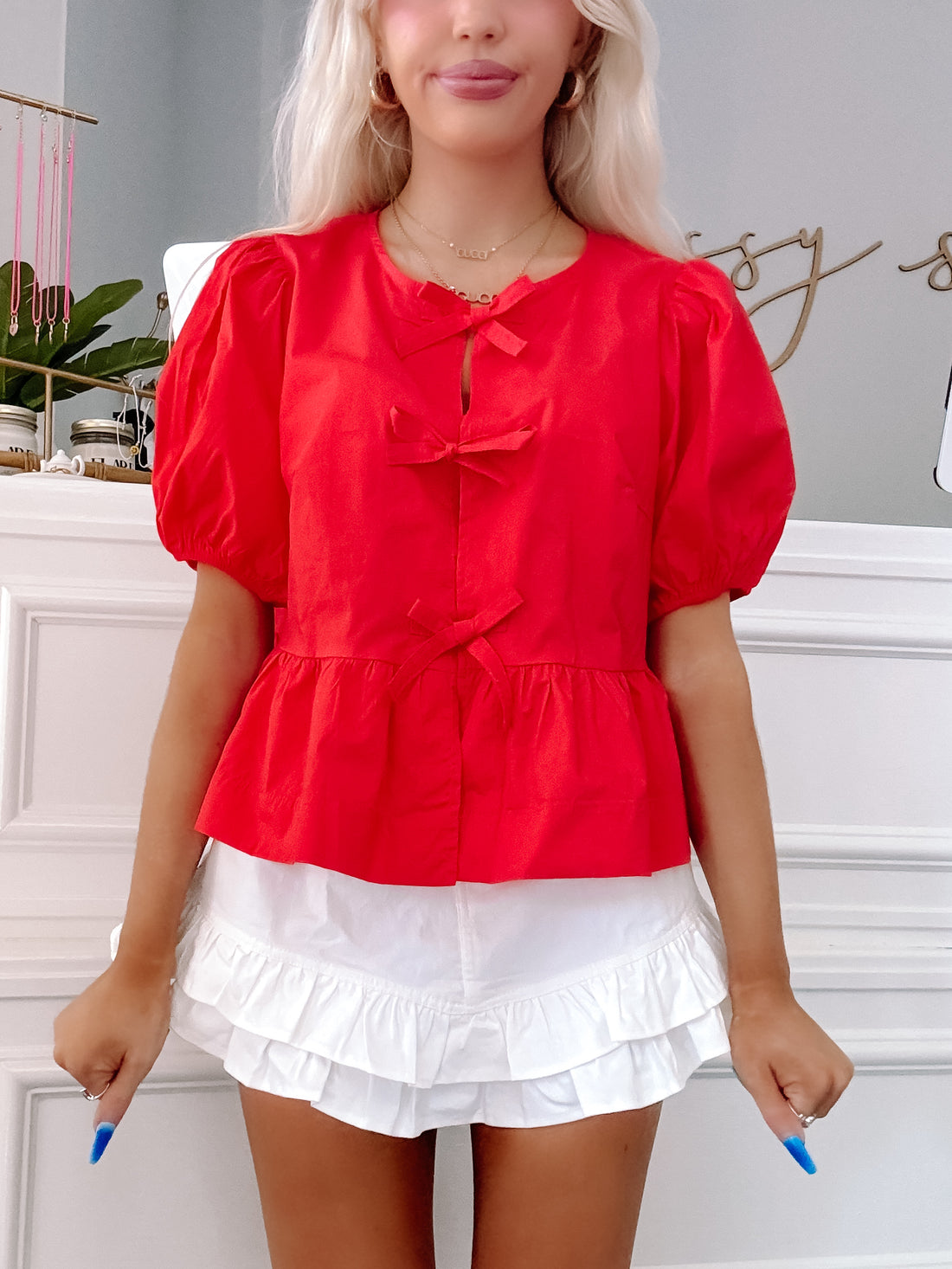 Ready to Bow Red puff sleeve top with trio of bow ties down the front, styled with white denim skirt from sassy shortcake
