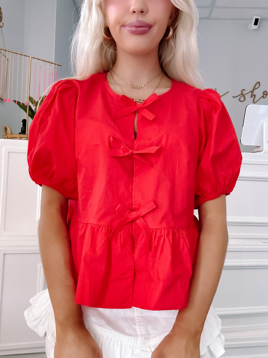 Close-up of front bows and fabric texture on red puff sleeve top - Ready to Bow Top from Sassy Shortcake