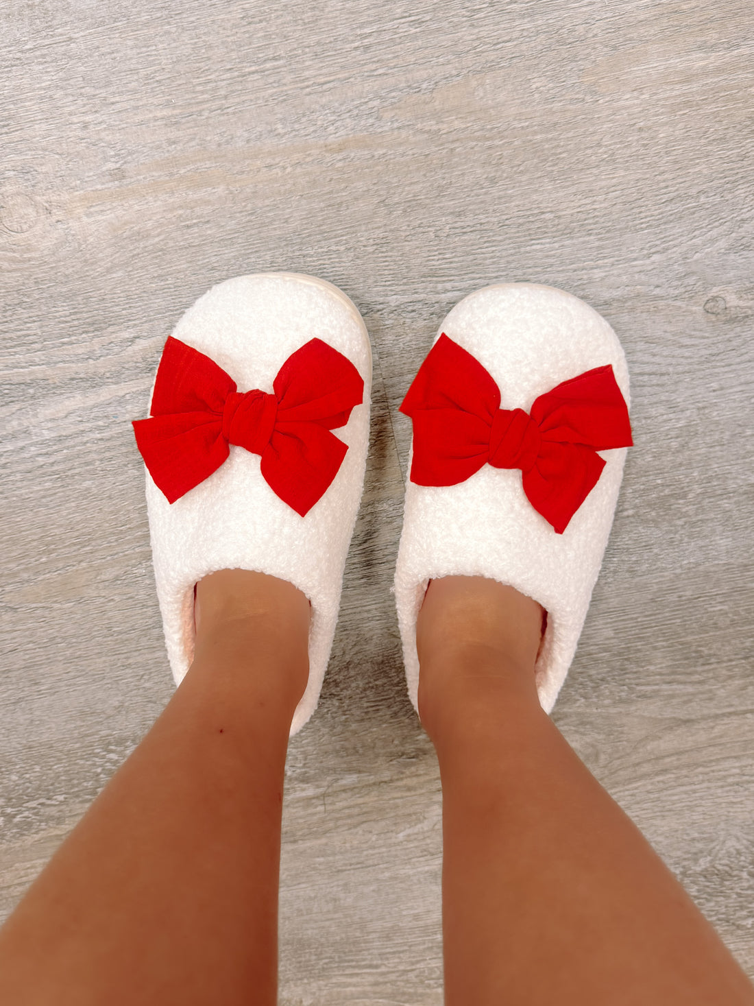 Sassy Shortcake Red Bow Slippers close-up showing soft sherpa and oversized bow detail