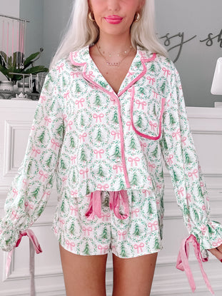 Ribbon & Rest Pajamas:  Women's Christmas pajama set, white with pink bows & trees, long sleeves & shorts, velvet accents.
