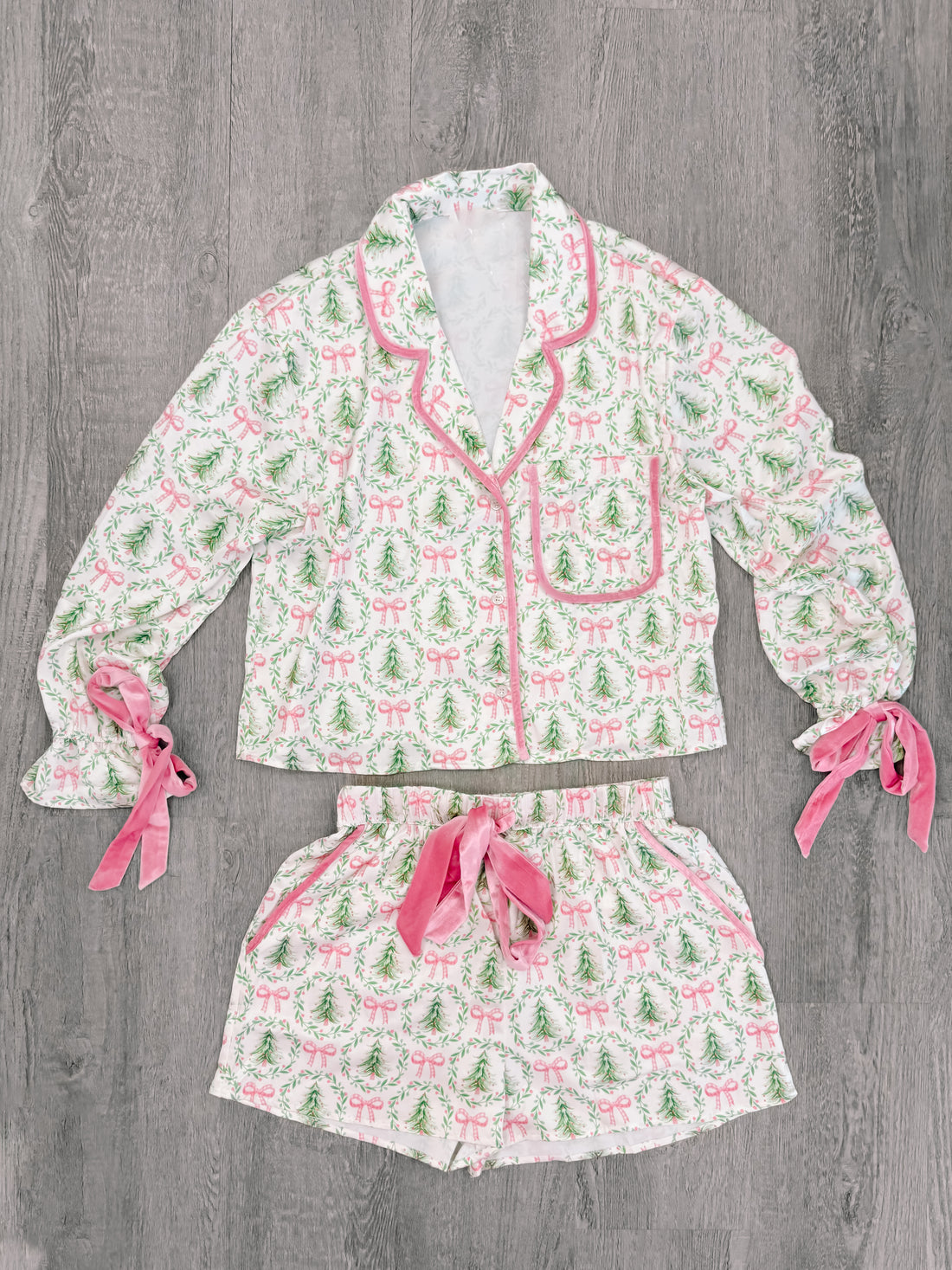 White pajama set with a festive Christmas tree print, pink velvet accents, and a comfortable loose fit from Sassy Shortcake
