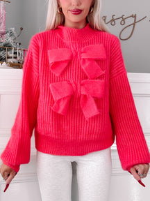 Rosy Ribbon hot pink knit sweater with oversized bow detail
