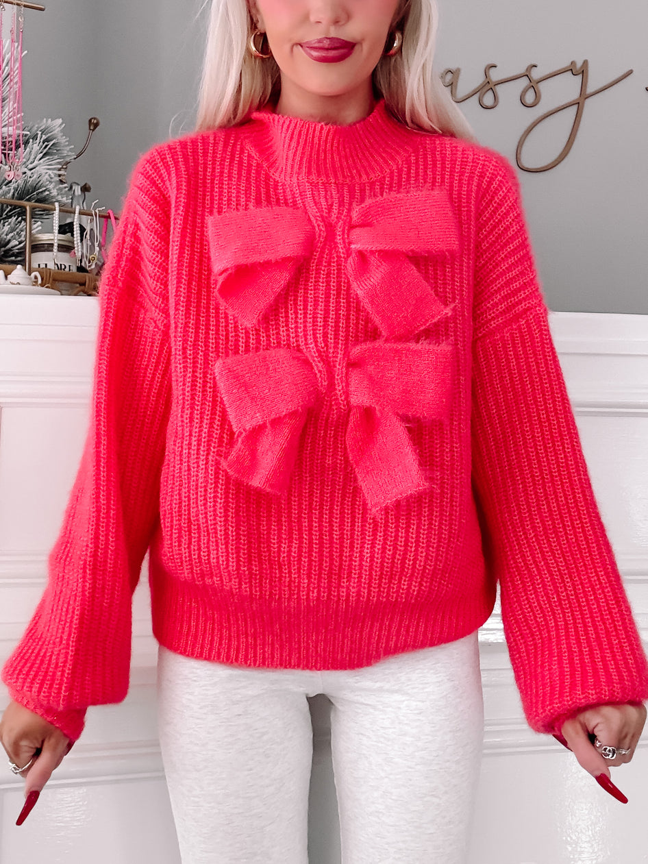 Rosy Ribbon hot pink knit sweater with oversized bow detail
