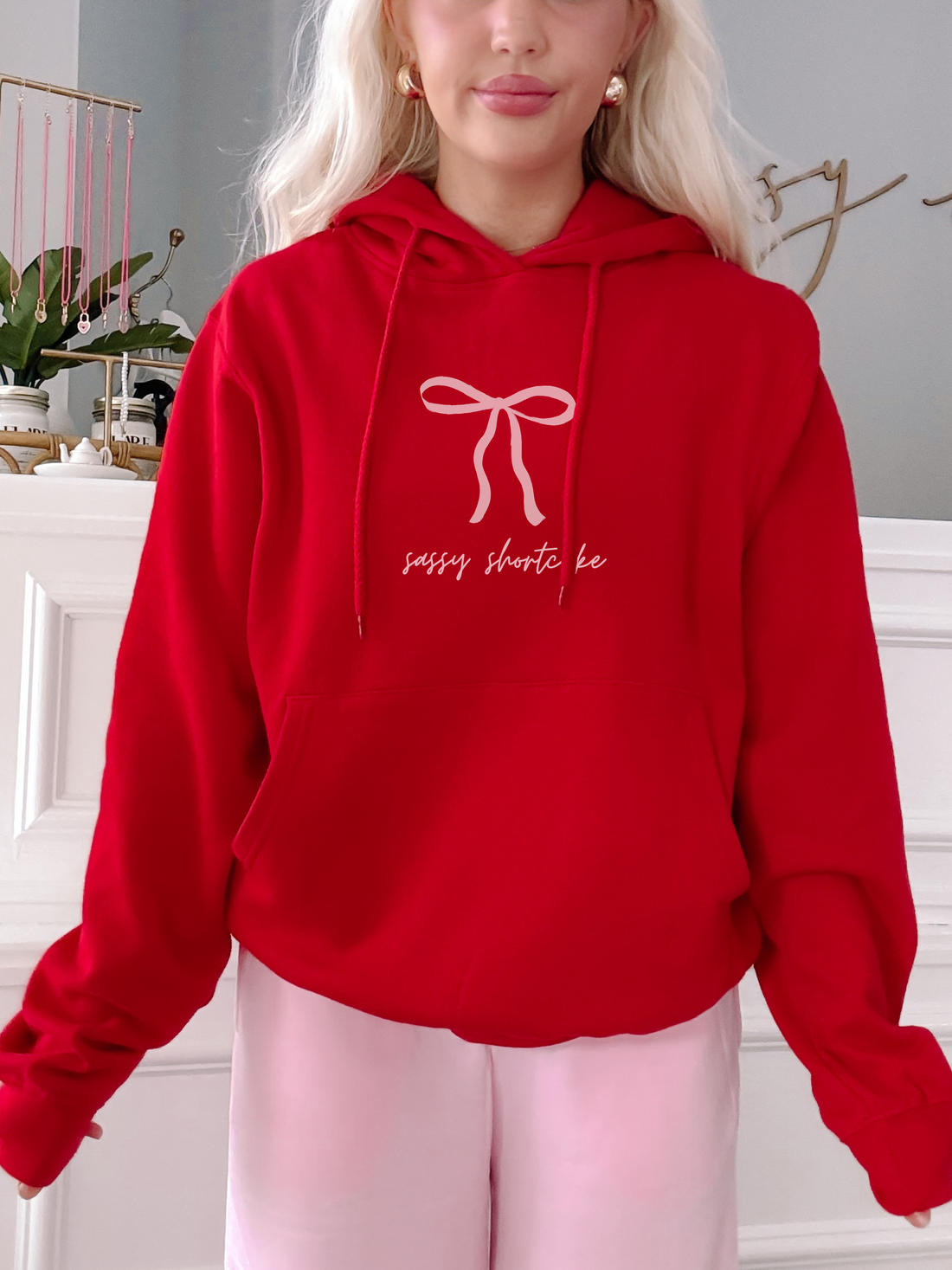 Red Sassy Shortcake hoodie with pink bow graphic
