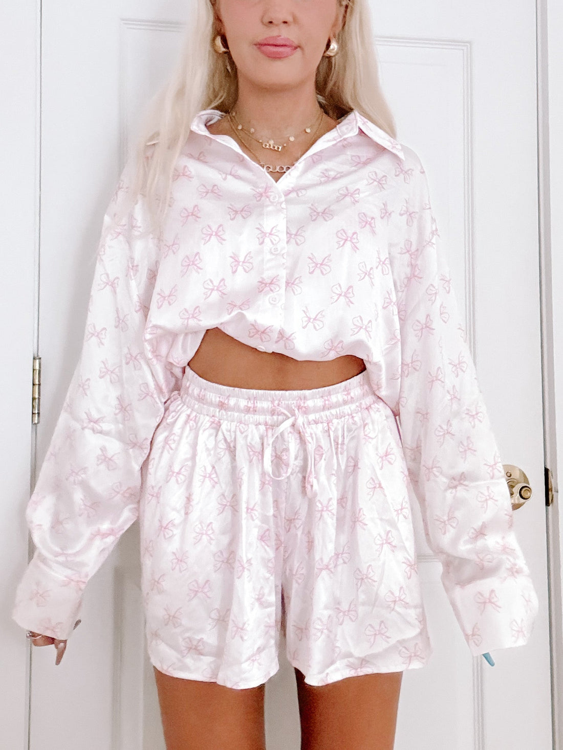 Satin Bow PJ Set: Pink bow print pajama set, featuring a relaxed button-down shirt and shorts from Sassy Shortcake

