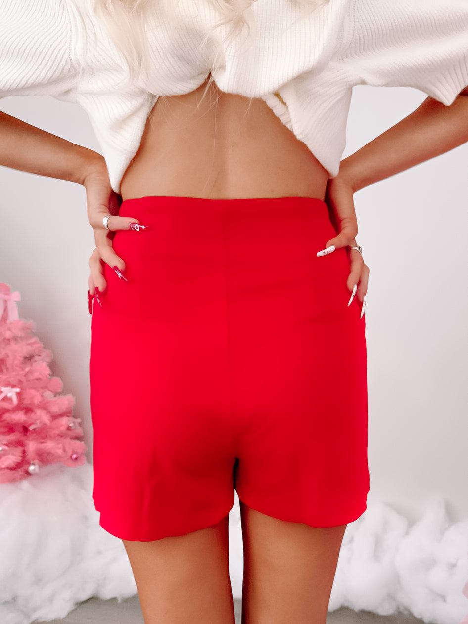 Red mini skirt, rear view, shown on model against a white background.
