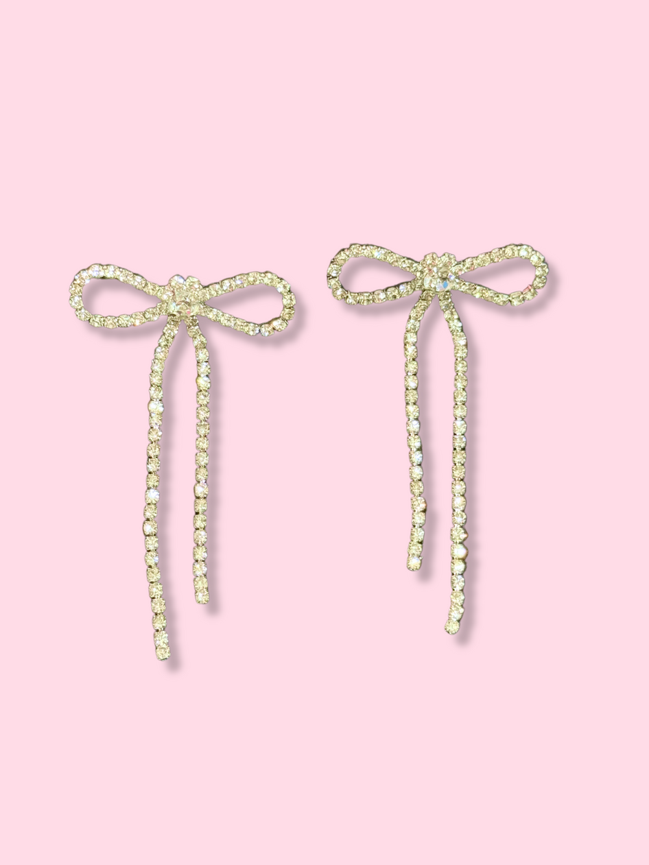 Shimmer Bow rhinestone earrings with dangling accents.
