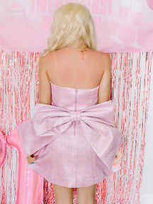 Back detail of Showstopper Dress by Sassy Shortcake, pink glitter mini dress with oversized detachable bow