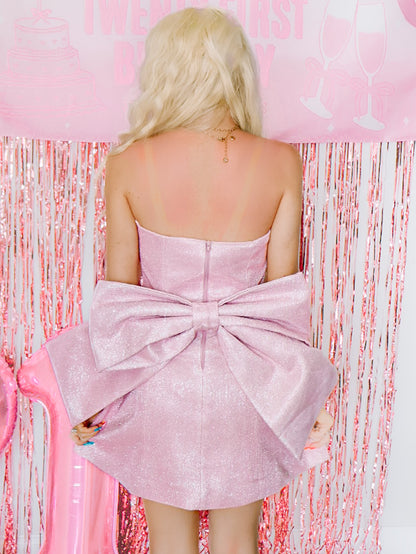 Back detail of Showstopper Dress by Sassy Shortcake, pink glitter mini dress with oversized detachable bow
