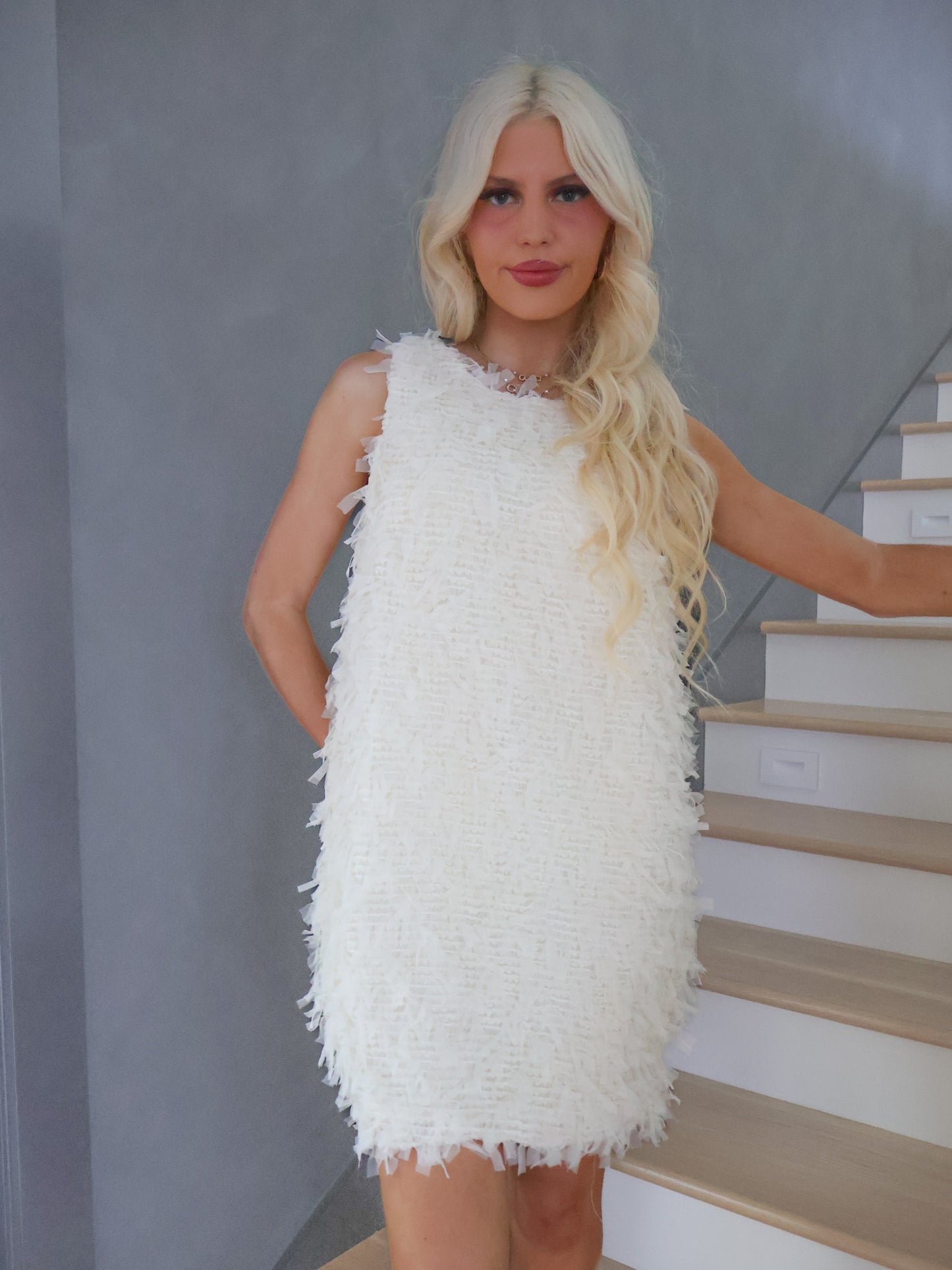 Close-up of Sassy Shortcake Snowfall Dress oversized white bow detail on the back, elegant holiday party dress accent.