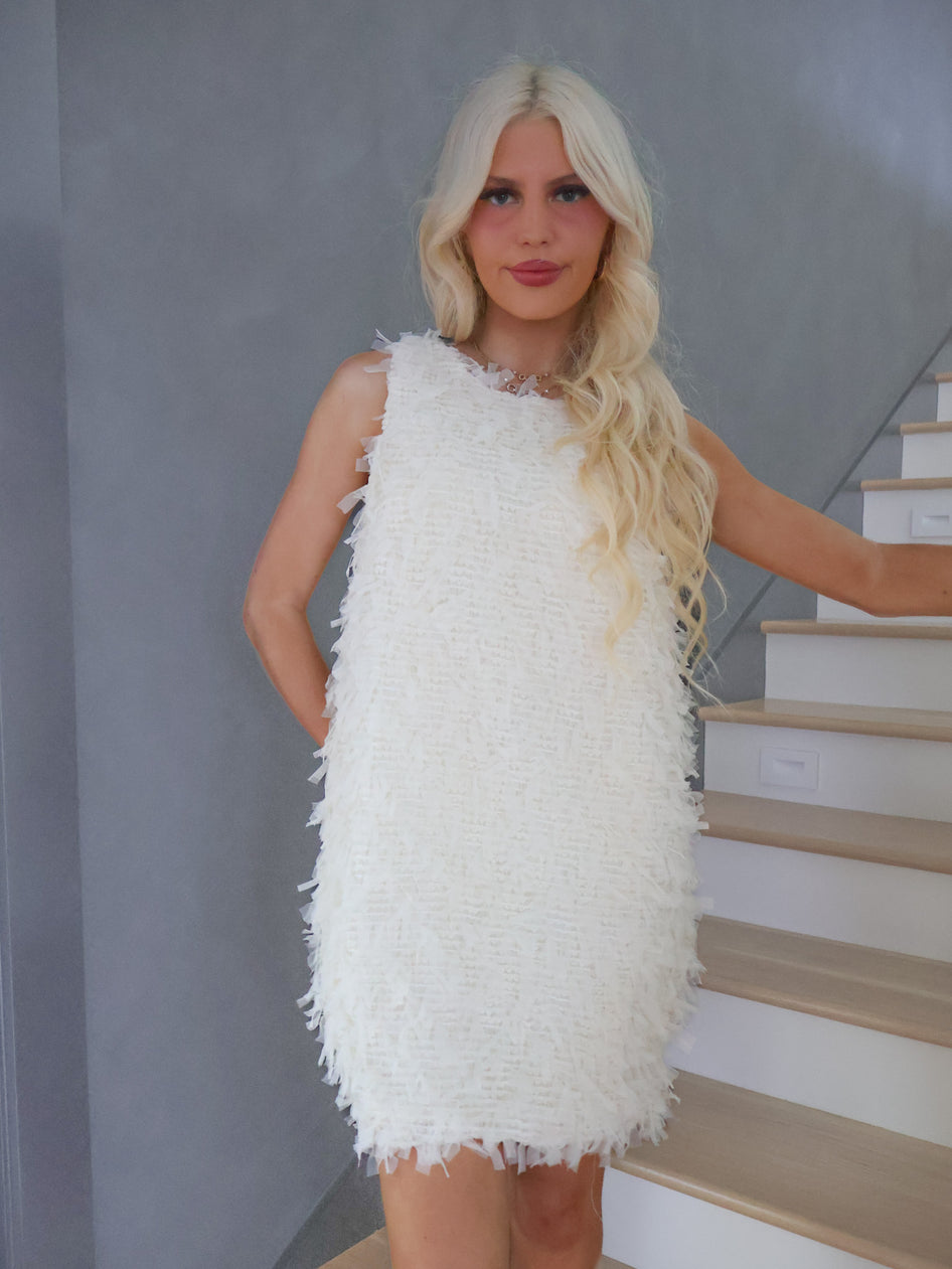 Close-up of Sassy Shortcake Snowfall Dress oversized white bow detail on the back, elegant holiday party dress accent.