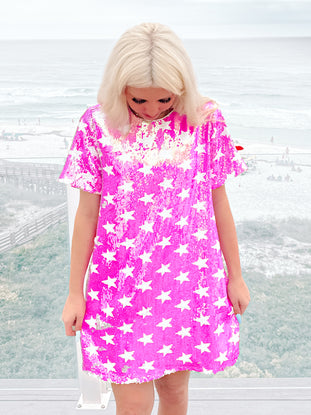 Hot pink Starlit Glow sequin mini dress with white stars; perfect for parties!
